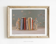 Charger l'image dans la galerie, Painting of books between bookends which are an 18th century couple.