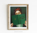 A woman holding a book called A Victorian's Guide to Time Travel. She is wearing Nail Polish. 